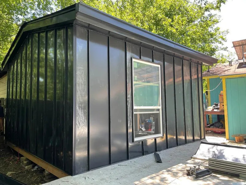 Black standing seam metal wall panels for Roof Inspection in Albany